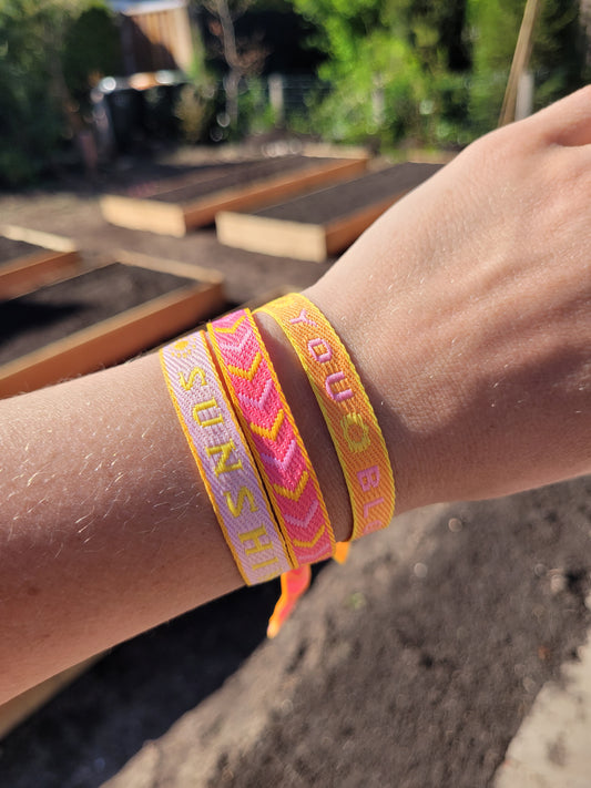 Festivalarmbandjes oranje, roze en rood