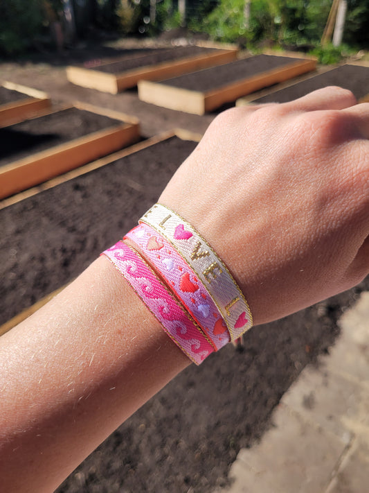 Festivalarmbandjes roze en rood