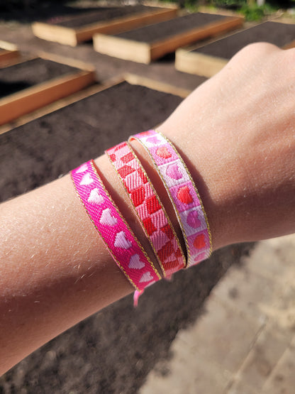Festivalarmbandjes roze en rood