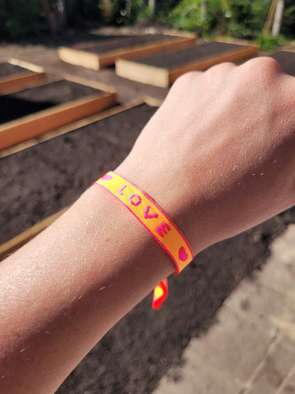 Festivalarmbandjes oranje, roze en rood